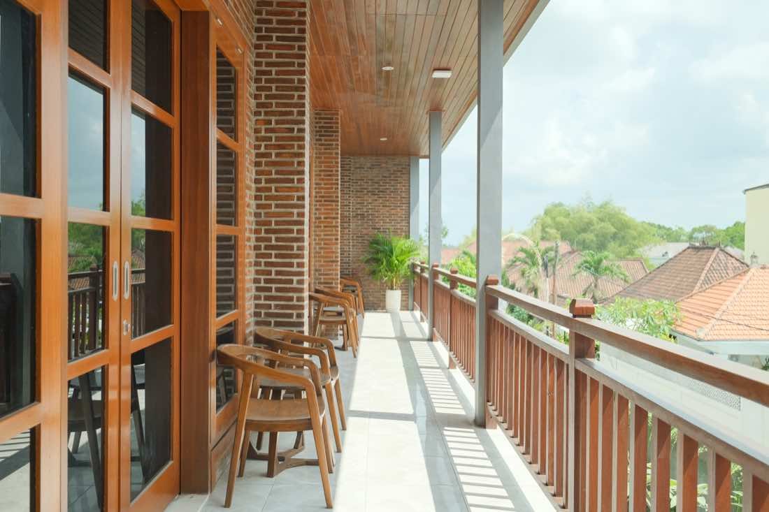 Covered balcony seating where breakfast and coffee are served