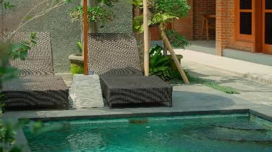 Sun loungers beside the pool at Santera Village